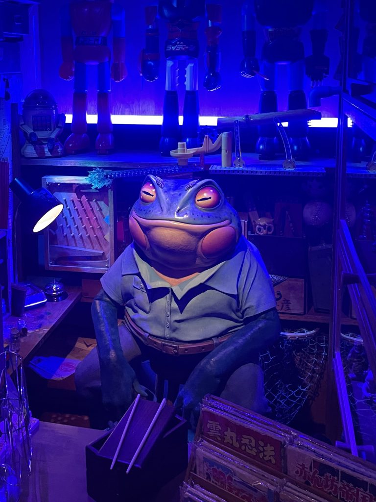 A frog sculpture inside Utah's Himitsu Station